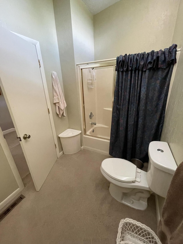 bathroom featuring shower / bath combination with curtain and toilet