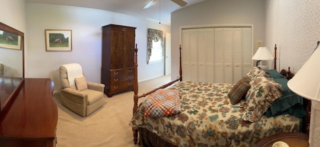 bedroom with lofted ceiling, light colored carpet, and ceiling fan