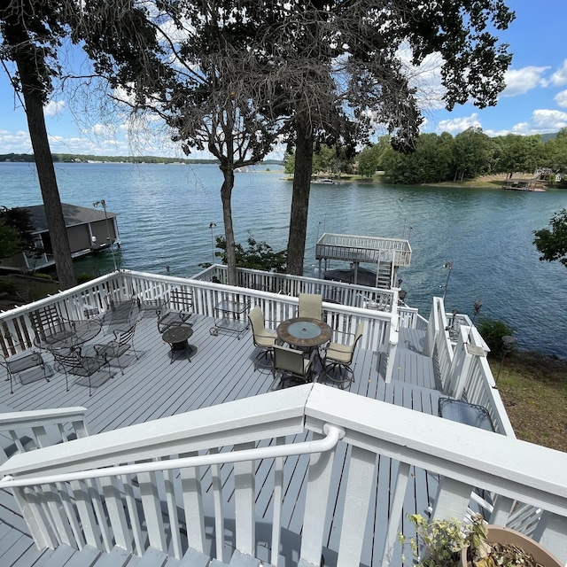 wooden deck with a water view