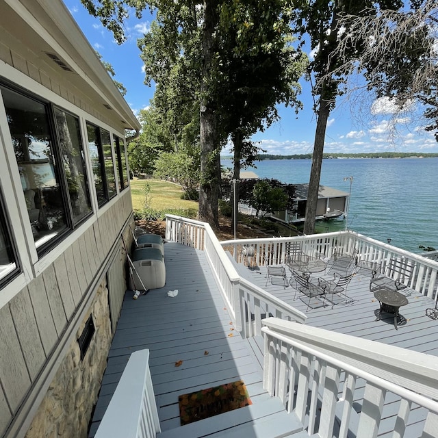 wooden deck with a water view