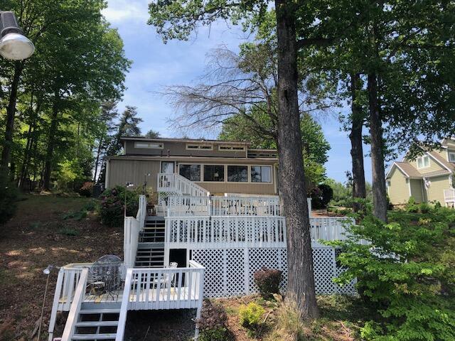 rear view of house featuring a deck