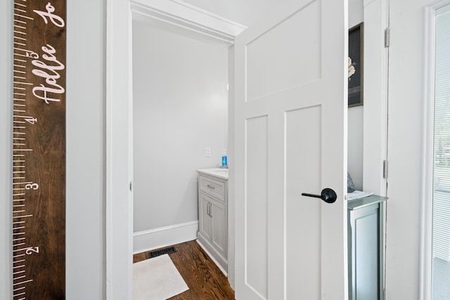 bathroom with vanity and hardwood / wood-style floors