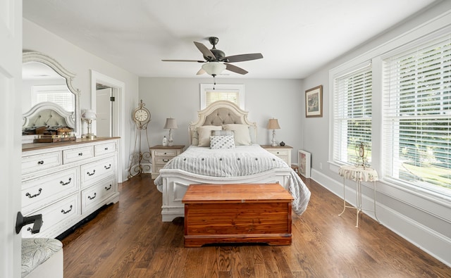 bedroom featuring ceiling fan and dark hardwood / wood-style floors