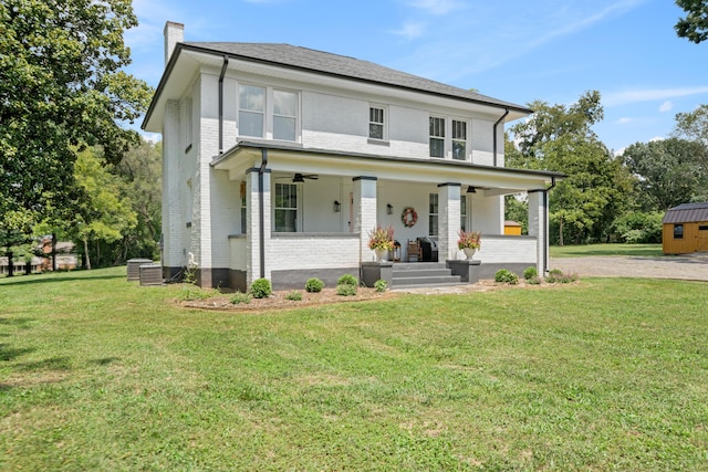 view of front of property with a porch and a front yard