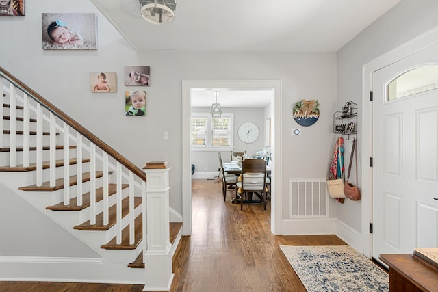 foyer entrance featuring hardwood / wood-style floors