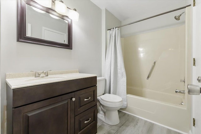 full bathroom featuring shower / tub combo, vanity, toilet, and hardwood / wood-style floors