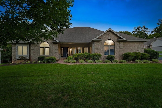 view of front of property with a yard