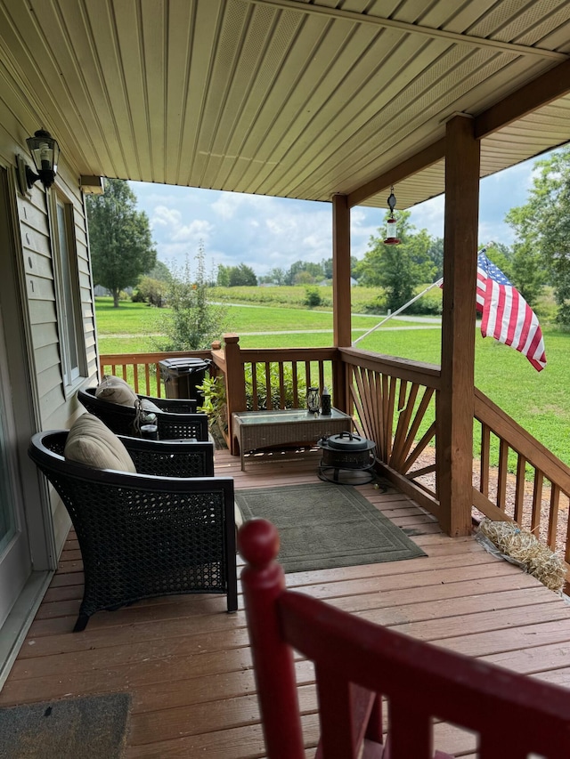 wooden deck with a lawn