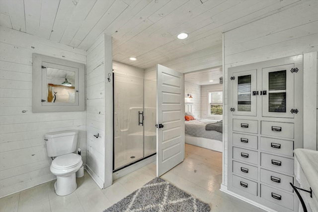 bathroom with hardwood / wood-style flooring, wood walls, toilet, and wooden ceiling