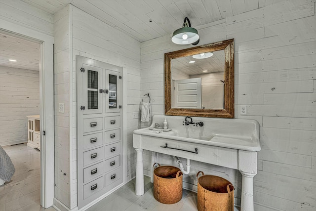 bathroom featuring hardwood / wood-style flooring, wooden walls, and wooden ceiling