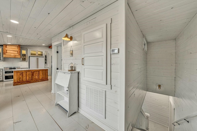 bathroom with wood ceiling, wood-type flooring, and wood walls