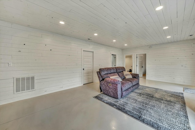 living room featuring wooden walls and wood ceiling