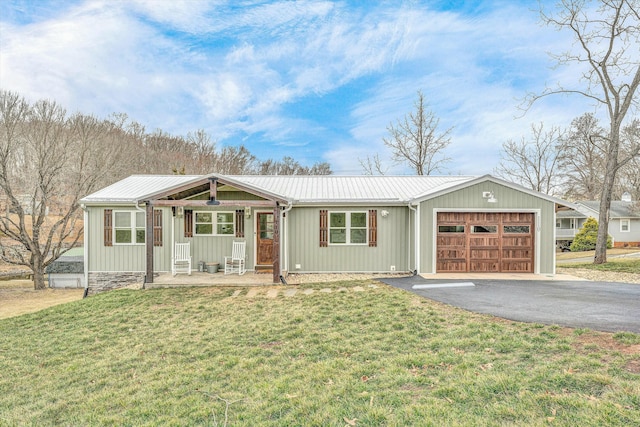 ranch-style house with a porch, a garage, and a front lawn