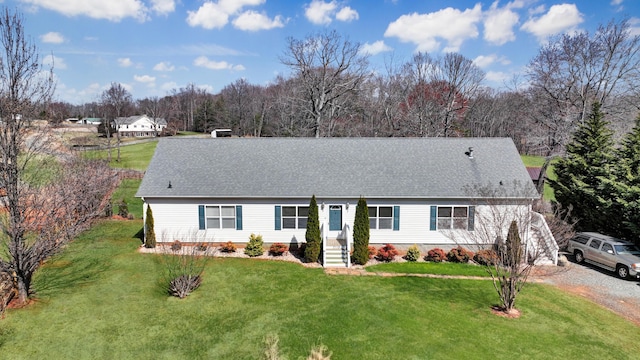 view of front of property featuring crawl space, a shingled roof, and a front lawn