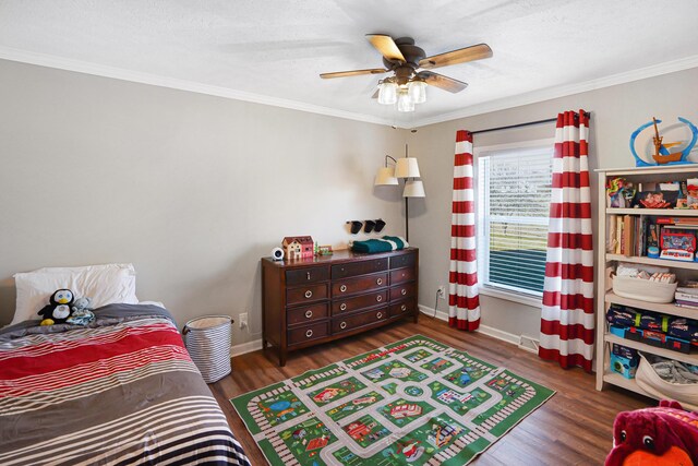 bedroom featuring hardwood / wood-style flooring, ceiling fan, and crown molding