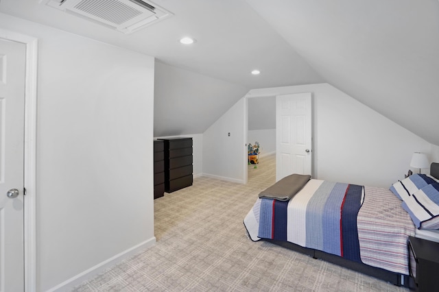 carpeted bedroom featuring vaulted ceiling