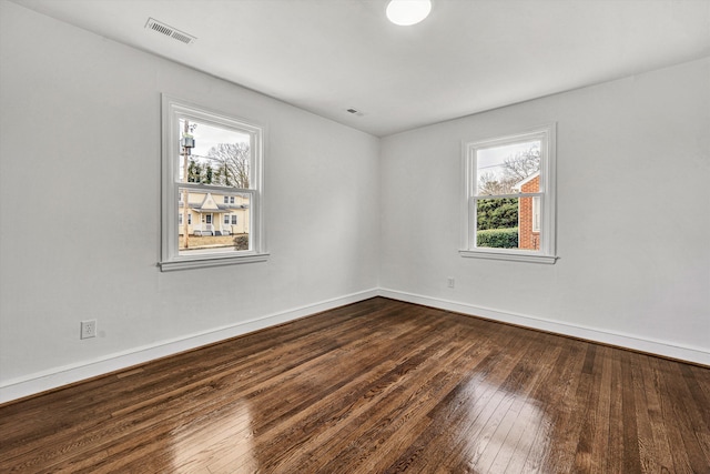 unfurnished room with hardwood / wood-style floors