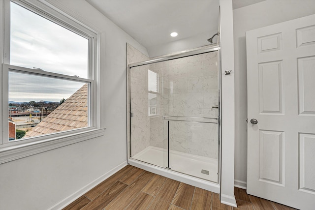 bathroom with hardwood / wood-style floors and walk in shower