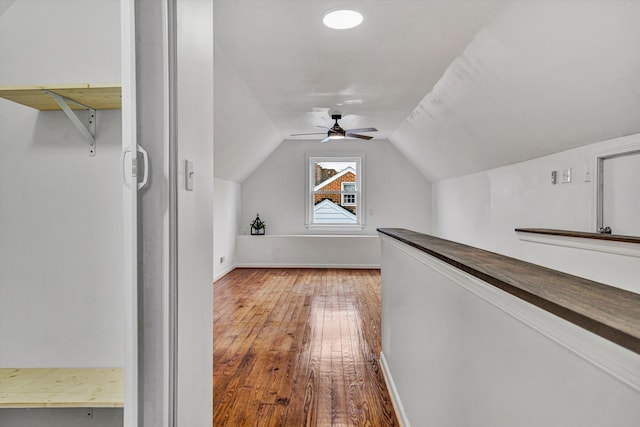 bonus room with hardwood / wood-style flooring, ceiling fan, and lofted ceiling