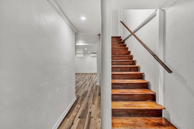 stairway featuring wood-type flooring