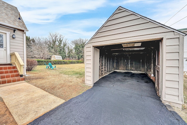 garage featuring a yard