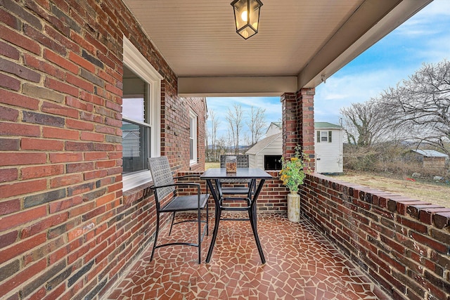 view of patio with an outbuilding