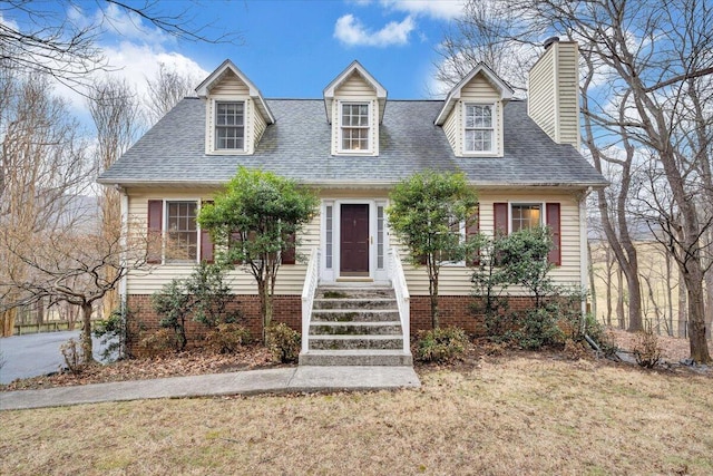 new england style home featuring a front yard