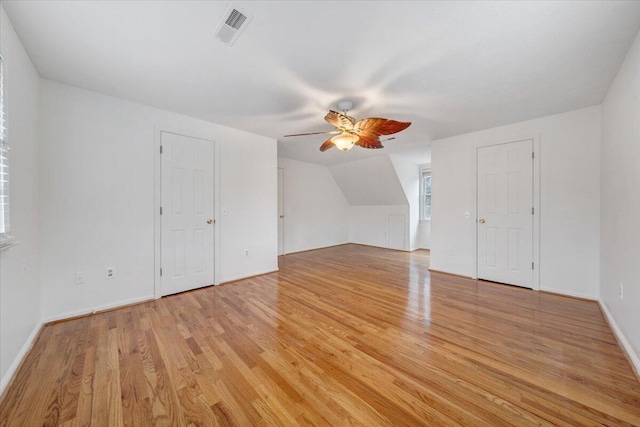 bonus room featuring vaulted ceiling, ceiling fan, and light wood-type flooring