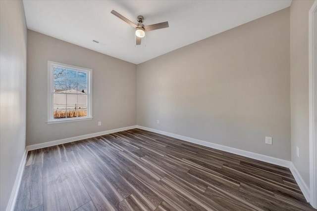 unfurnished room featuring dark wood-type flooring and ceiling fan