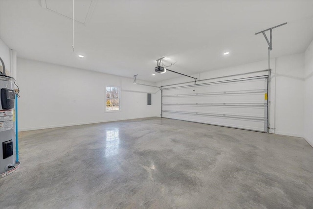 garage with a garage door opener and water heater