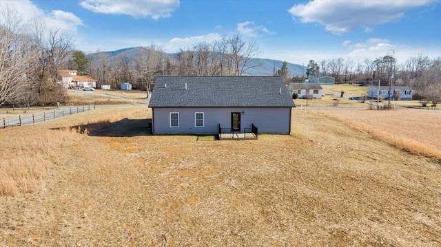 back of property featuring a mountain view