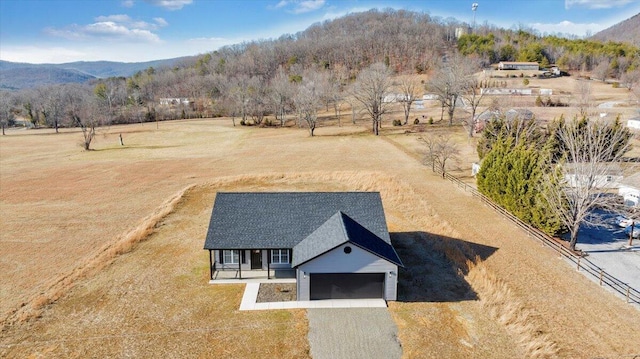 aerial view with a mountain view and a rural view