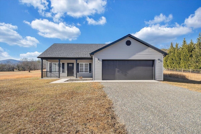 ranch-style home with a porch, a garage, and a front yard