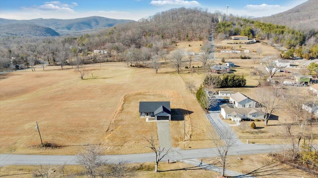 drone / aerial view with a mountain view and a rural view