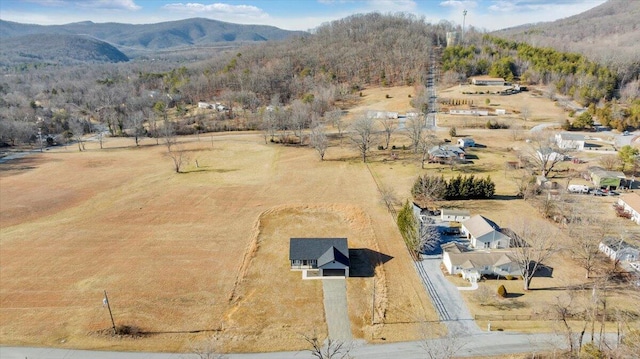 birds eye view of property with a mountain view and a rural view