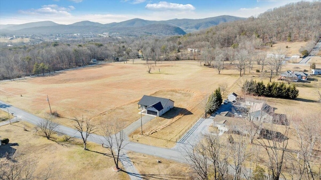 birds eye view of property featuring a mountain view and a rural view