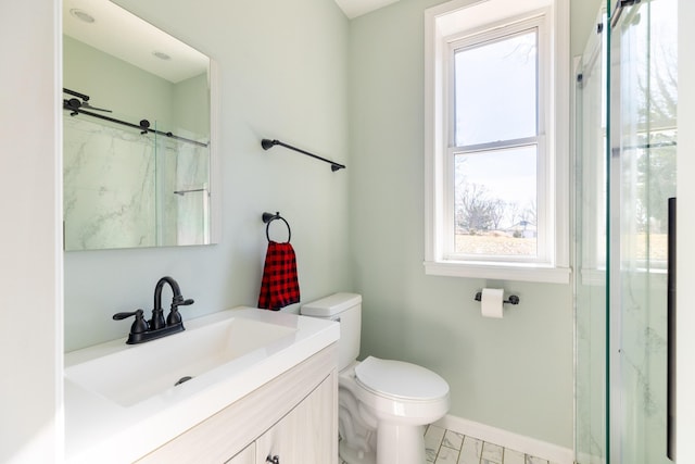 bathroom with vanity, a shower, and toilet