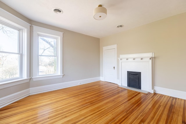 unfurnished living room featuring light hardwood / wood-style flooring