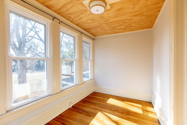 unfurnished sunroom featuring wooden ceiling