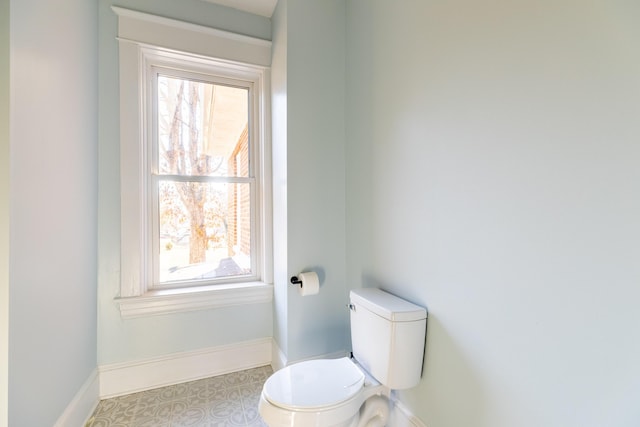 bathroom with tile patterned flooring and toilet