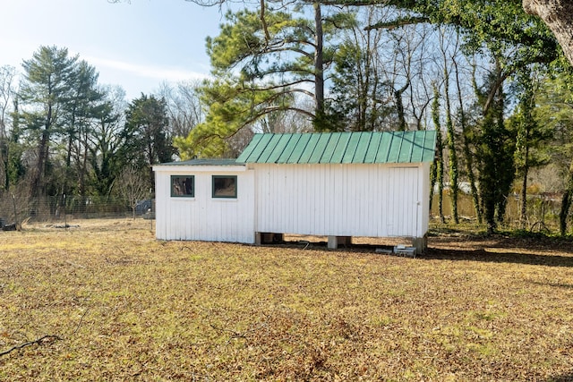 view of outbuilding with a lawn