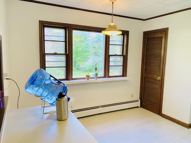 interior space with a baseboard radiator and crown molding