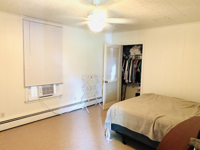 bedroom with cooling unit, a baseboard heating unit, a closet, and ceiling fan