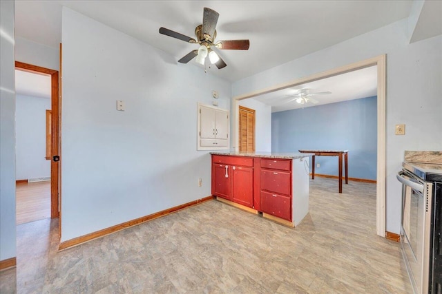 kitchen with stainless steel range with electric cooktop and ceiling fan