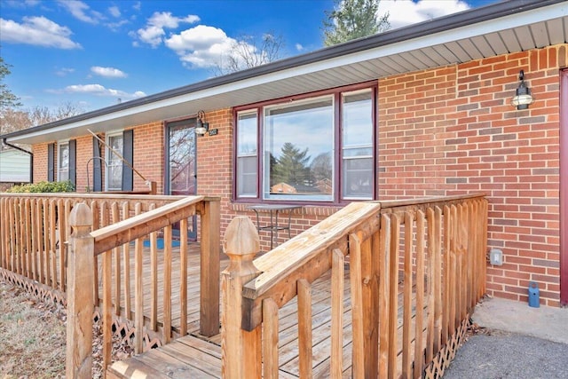 entrance to property featuring a deck