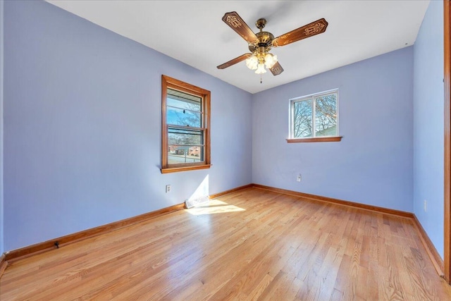 empty room featuring ceiling fan and light hardwood / wood-style floors