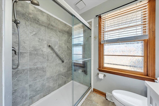 bathroom with walk in shower, vanity, and toilet