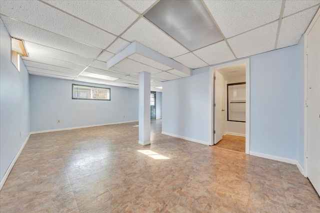 basement featuring a paneled ceiling