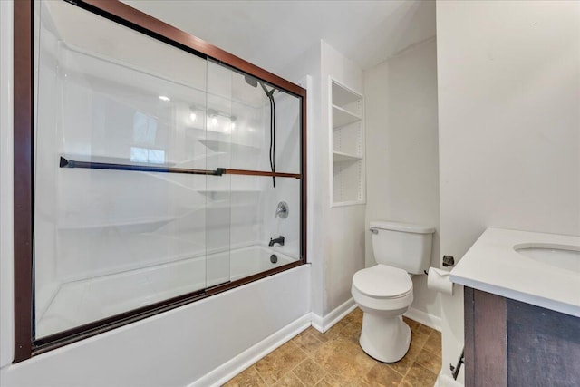 full bathroom with vanity, enclosed tub / shower combo, and toilet