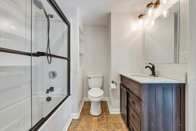 full bathroom with vanity, shower / bath combination with glass door, and toilet